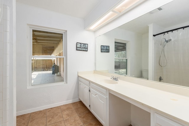 full bathroom featuring visible vents, baseboards, a shower with curtain, tile patterned floors, and vanity