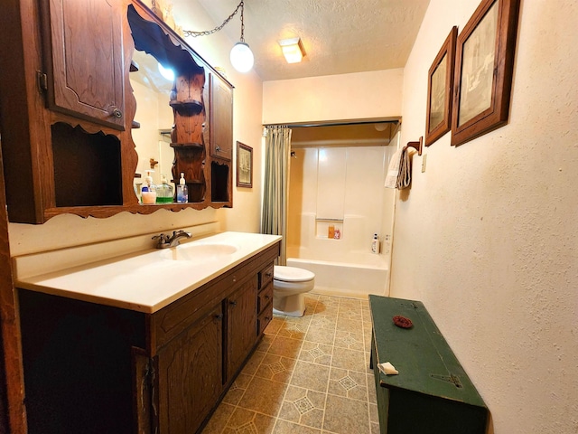 full bathroom featuring vanity, shower / bath combo, a textured ceiling, and toilet