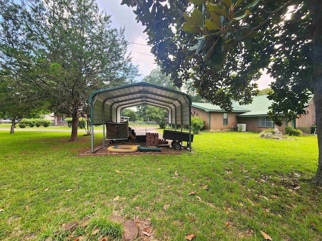 view of yard with a carport