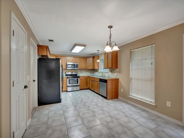 kitchen featuring pendant lighting, light tile patterned floors, stainless steel appliances, and sink