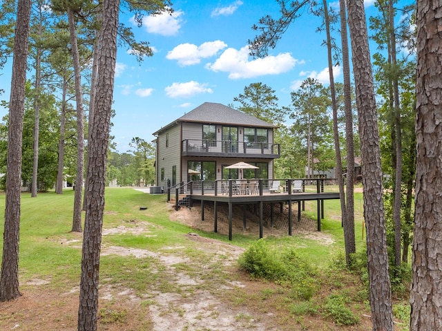 back of house featuring a lawn, a wooden deck, and cooling unit