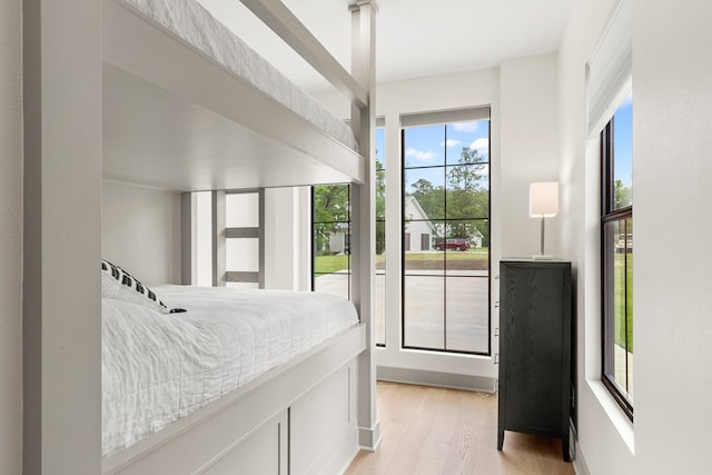 bedroom with light wood-type flooring
