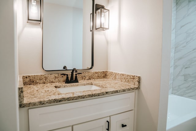 bathroom with a bathtub and vanity