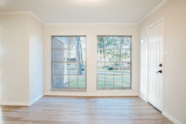 entryway featuring light hardwood / wood-style floors and crown molding