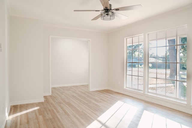 spare room featuring ceiling fan, light hardwood / wood-style flooring, and crown molding