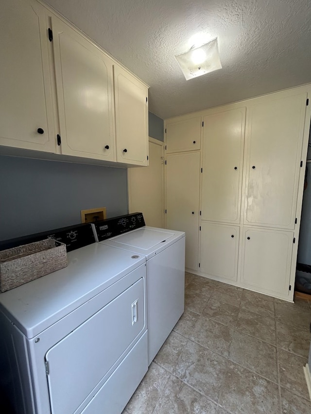 4928 Fm 252, Jasper, TX 75951 - washroom with cabinet space, separate washer and dryer, and a textured ceiling