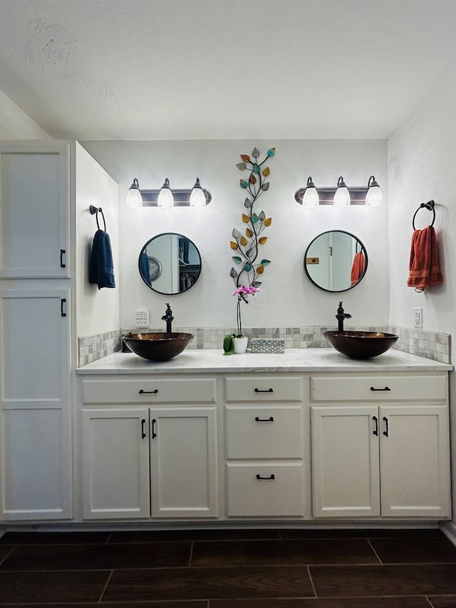 4928 Fm 252, Jasper, TX 75951 - bathroom featuring double vanity and wood finish floors