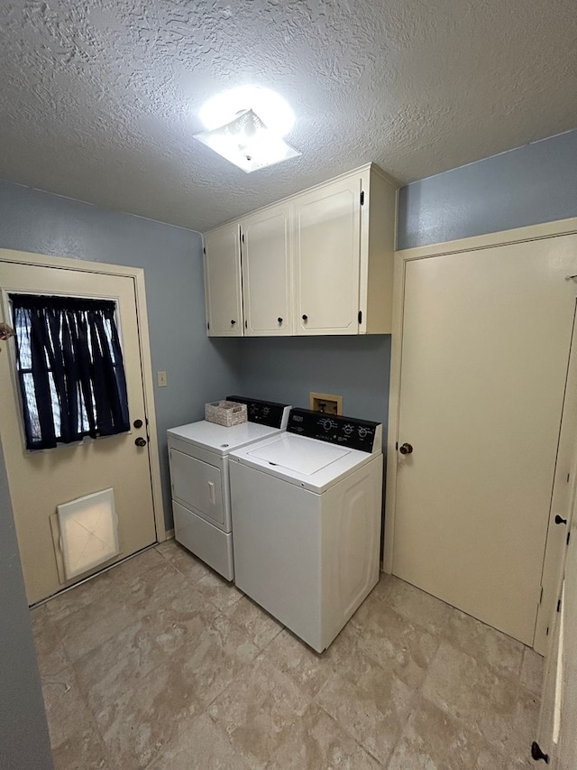 4928 Fm 252, Jasper, TX 75951 - washroom featuring independent washer and dryer, cabinet space, and a textured ceiling