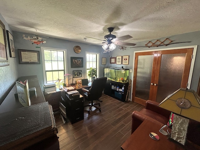 office area featuring a textured ceiling, ceiling fan, and wood finish floors