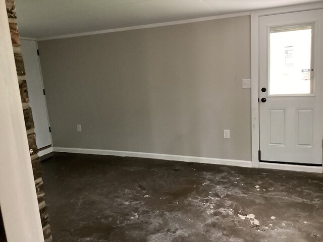 500 Herndon St, Kirbyville, TX 75956 - foyer with concrete flooring, crown molding, and baseboards