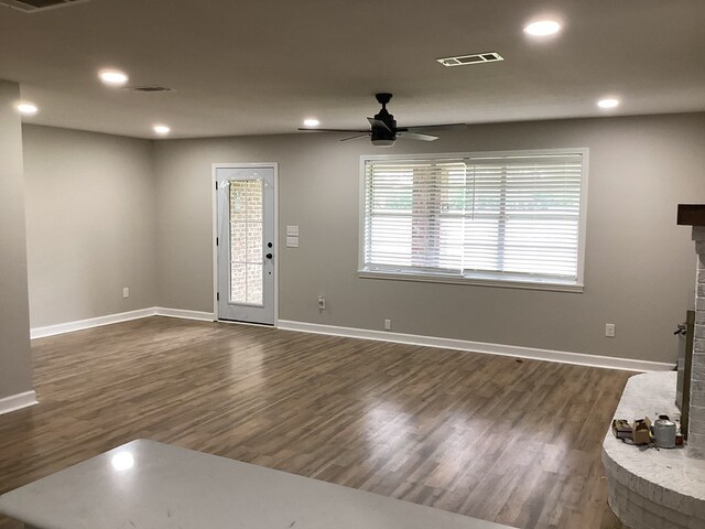 500 Herndon St, Kirbyville, TX 75956 - interior space featuring a brick fireplace, recessed lighting, dark wood-style floors, visible vents, and a ceiling fan