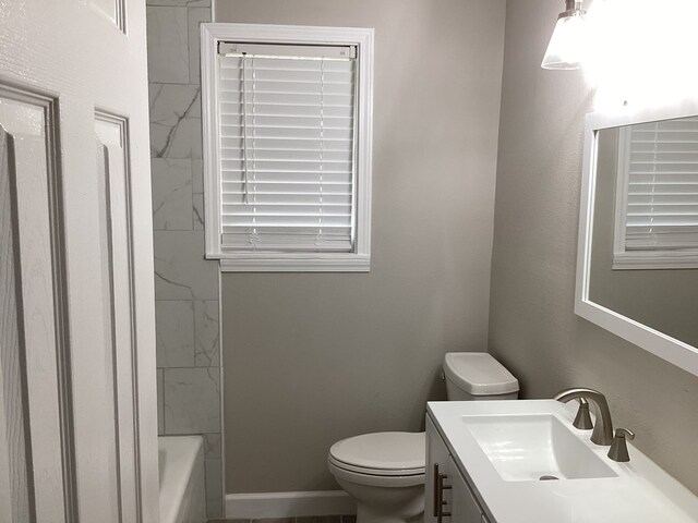 500 Herndon St, Kirbyville, TX 75956 - bathroom featuring toilet, vanity, and baseboards
