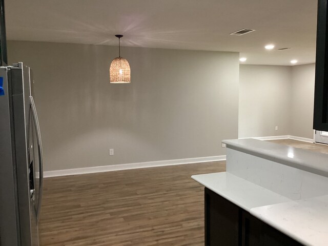 500 Herndon St, Kirbyville, TX 75956 - kitchen with light countertops, stainless steel fridge with ice dispenser, dark wood finished floors, baseboards, and recessed lighting