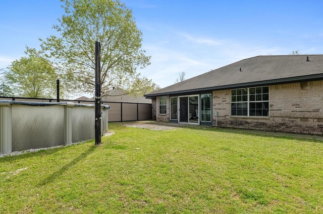 220 Casey Rd, Lufkin, TX 75901 - rear view of house with brick siding and a detached garage