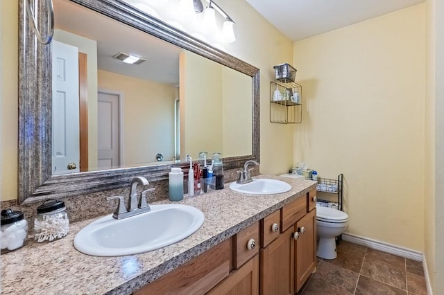 220 Casey Rd, Lufkin, TX 75901 - bathroom featuring double vanity and toilet