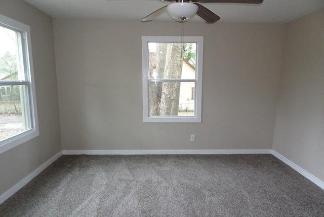 unfurnished room featuring carpet floors, baseboards, and a ceiling fan