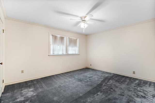 unfurnished room featuring ceiling fan, crown molding, and dark colored carpet