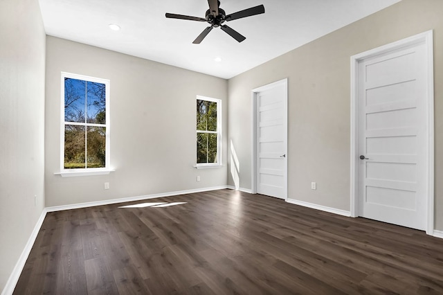 unfurnished bedroom featuring ceiling fan, recessed lighting, dark wood finished floors, and baseboards