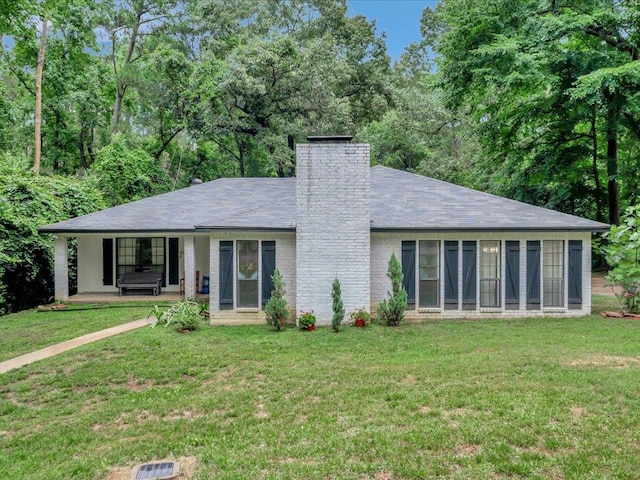 2600 Dogwood St, Nacogdoches, TX 75965 - view of front of house with a chimney and a front yard