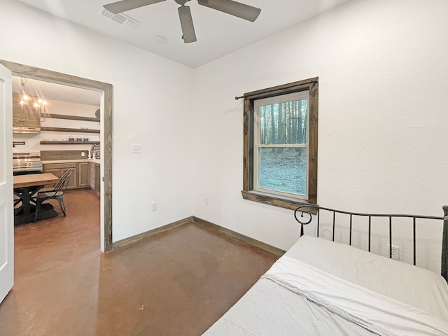 bedroom with concrete flooring and ceiling fan