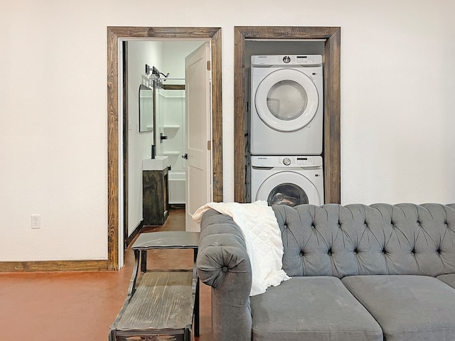 laundry room with stacked washer and dryer