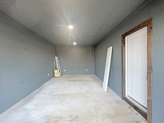 unfurnished room with concrete floors