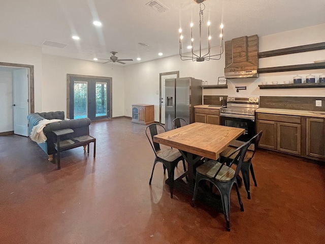 dining space featuring ceiling fan with notable chandelier