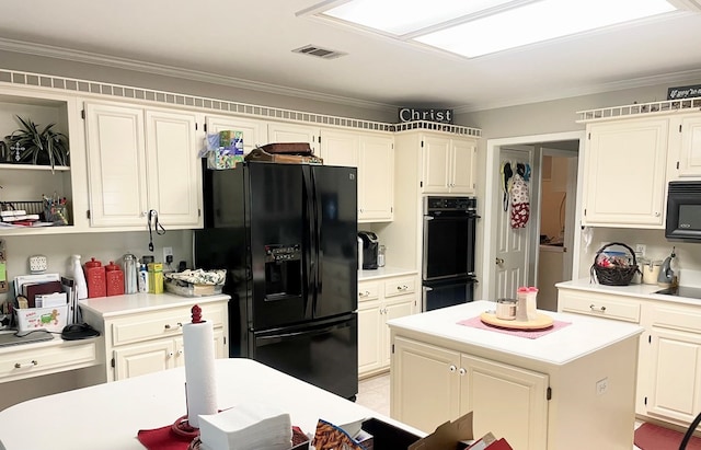 701 Shady Ln, Diboll, TX 75941 - kitchen featuring black appliances, light countertops, a kitchen island, and ornamental molding