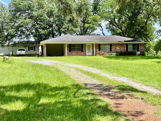 7203 Fm 326, Lufkin, TX 75901 - single story home featuring dirt driveway, a front yard, and brick siding