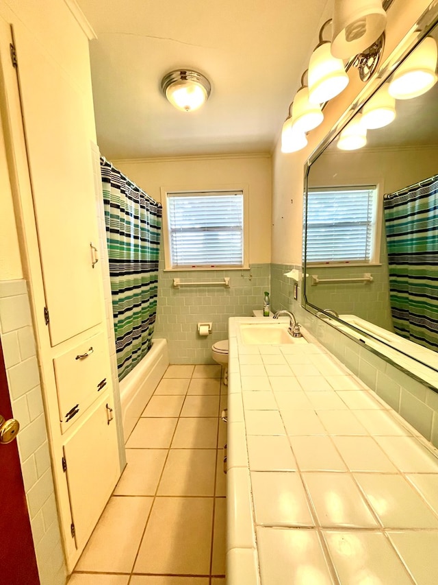 7203 Fm 326, Lufkin, TX 75901 - bathroom featuring tile patterned floors, tile walls, vanity, wainscoting, and ornamental molding