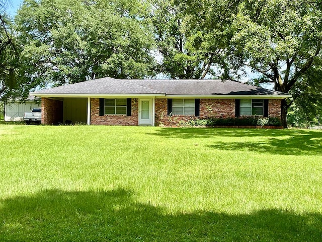 7203 Fm 326, Lufkin, TX 75901 - ranch-style home featuring a front yard, brick siding, and roof with shingles