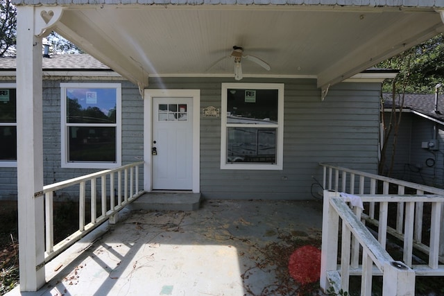 property entrance with ceiling fan