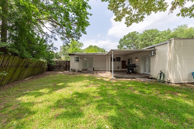 1402 Robinwood, Lufkin, TX 75904 - rear view of property with a patio area, a wall mounted air conditioner, and french doors