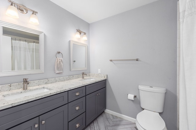 1402 Robinwood, Lufkin, TX 75904 - bathroom featuring toilet, double vanity, baseboards, and a shower with shower curtain