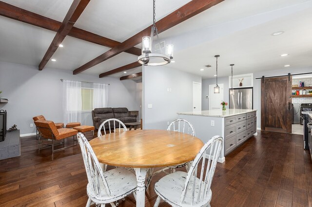 1402 Robinwood, Lufkin, TX 75904 - dining room with a barn door, beam ceiling, dark wood-style flooring, recessed lighting, and washer and clothes dryer