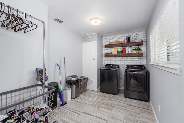 1402 Robinwood, Lufkin, TX 75904 - laundry area with washer and clothes dryer and baseboards