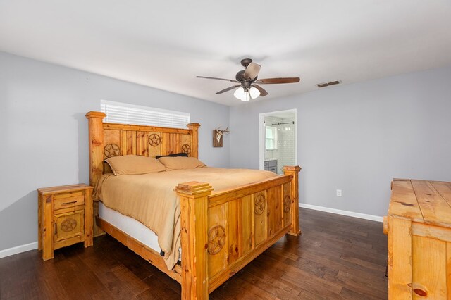 1402 Robinwood, Lufkin, TX 75904 - bedroom featuring dark wood-type flooring, baseboards, a ceiling fan, and ensuite bathroom