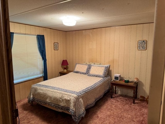 bedroom featuring dark carpet