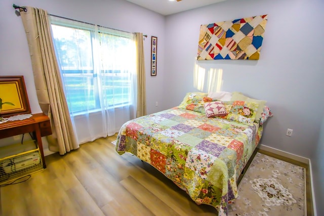 bedroom with hardwood / wood-style flooring