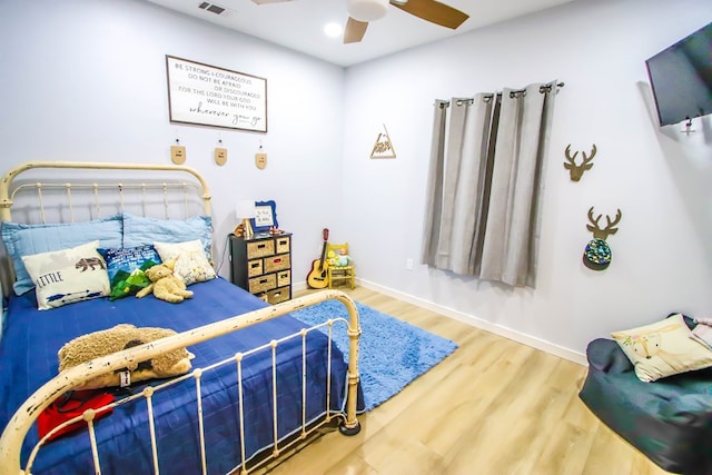 bedroom featuring ceiling fan and hardwood / wood-style floors