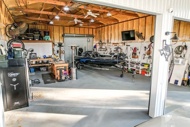 garage featuring a workshop area and ceiling fan