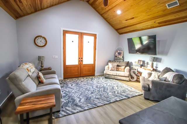 living room featuring hardwood / wood-style flooring, vaulted ceiling, wooden ceiling, and french doors