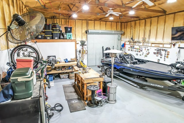 garage featuring a workshop area and ceiling fan