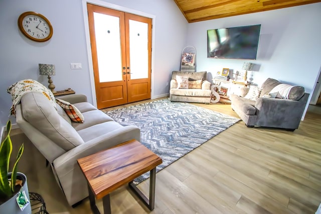 living room with french doors, wood ceiling, lofted ceiling, and hardwood / wood-style floors