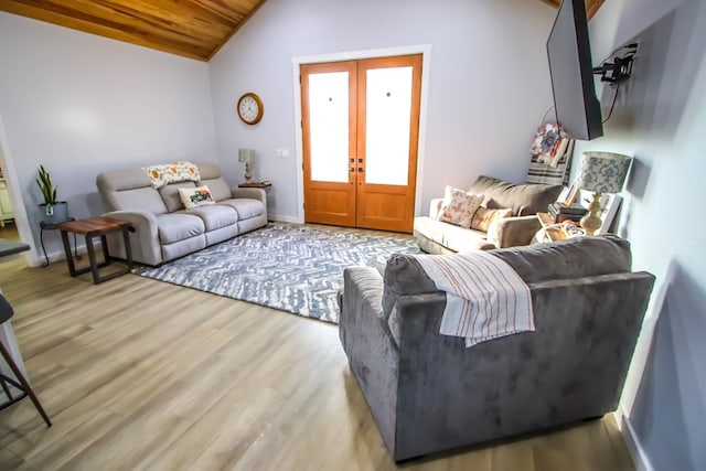 living room featuring french doors, wooden ceiling, vaulted ceiling, and light hardwood / wood-style flooring