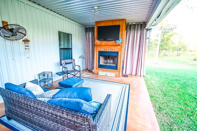 view of patio with a fireplace