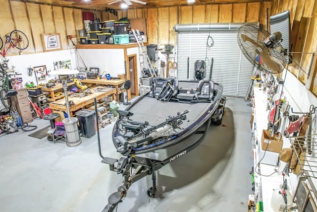 garage with a workshop area and ceiling fan