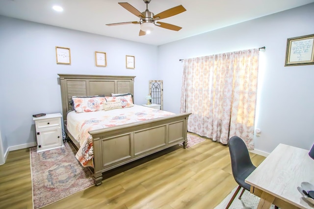 bedroom with ceiling fan and light wood-type flooring