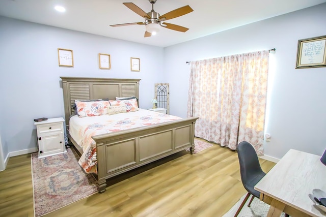 bedroom with ceiling fan and light wood-type flooring