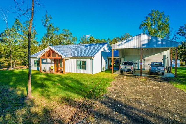 back of property featuring a lawn and a carport